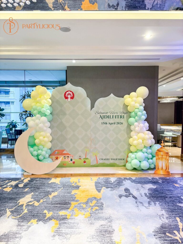 Hari Raya Aidilfitri corporate backdrop with balloon garland and crescent moon prop, built for CHAGEE